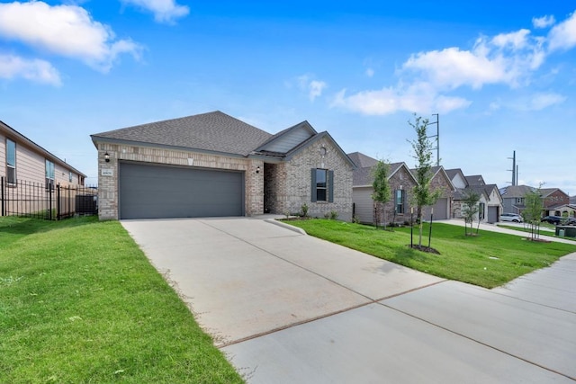 view of front of property featuring brick siding, fence, an attached garage, concrete driveway, and a front yard