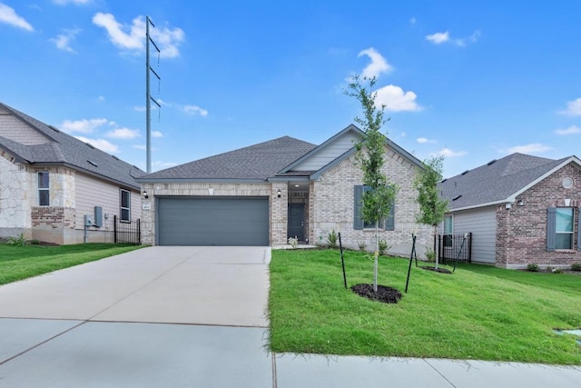 single story home with concrete driveway, an attached garage, a front lawn, and fence