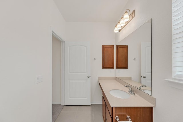 bathroom with tile patterned flooring and vanity