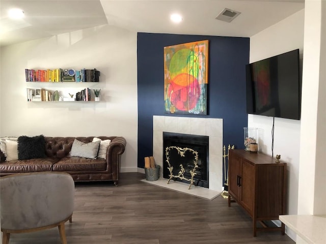 6409 Burns St Unit 306, Austin, TX 78752 - living area featuring wood finished floors, visible vents, recessed lighting, a fireplace, and vaulted ceiling
