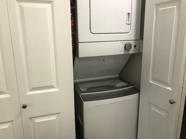 6409 Burns St Unit 306, Austin, TX 78752 - laundry room featuring laundry area and stacked washer and dryer