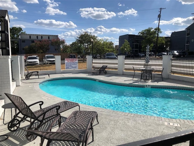 6409 Burns St Unit 306, Austin, TX 78752 - pool featuring a patio area and fence