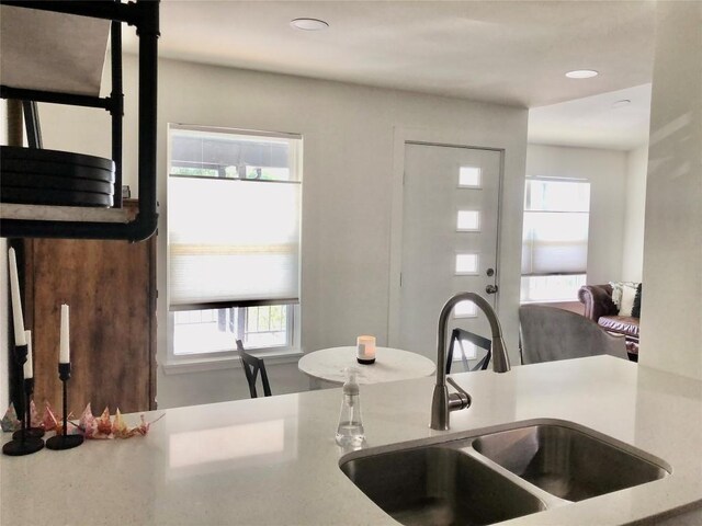 6409 Burns St Unit 306, Austin, TX 78752 - kitchen with recessed lighting, light countertops, a healthy amount of sunlight, and a sink