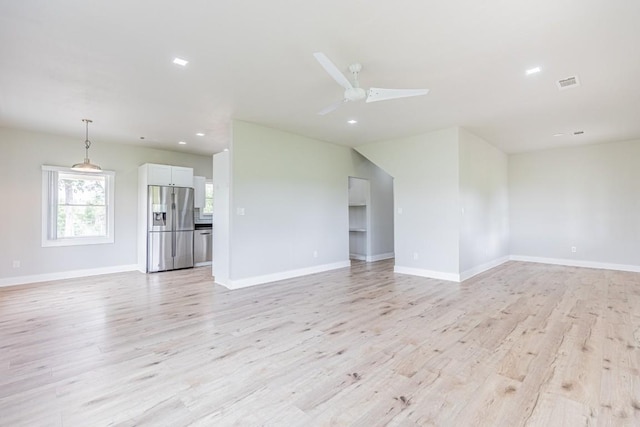 empty room featuring recessed lighting, baseboards, ceiling fan, visible vents, and light wood-style floors