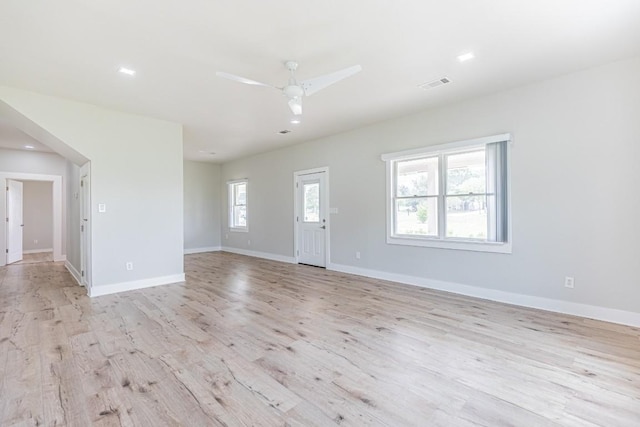 unfurnished living room with recessed lighting, baseboards, ceiling fan, visible vents, and light wood-style floors
