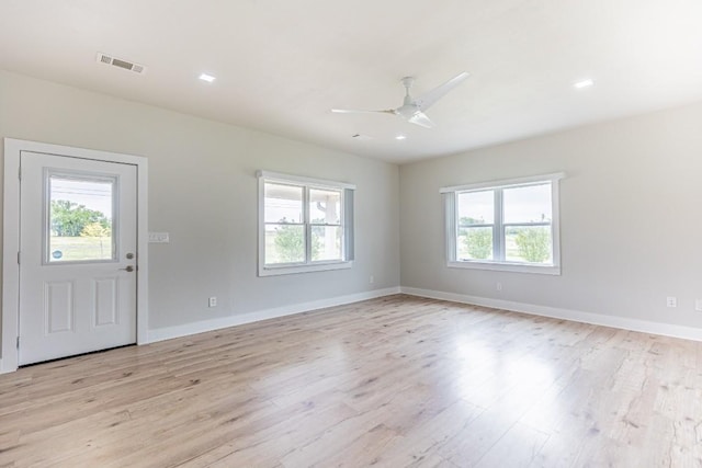 interior space featuring visible vents, recessed lighting, ceiling fan, light wood-style flooring, and baseboards