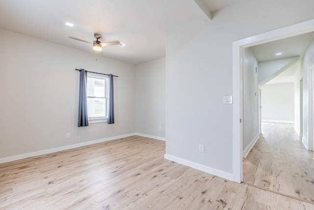 unfurnished room with baseboards, light wood-style flooring, and a ceiling fan