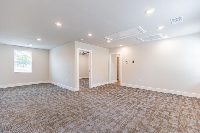 basement with carpet floors, baseboards, visible vents, and recessed lighting