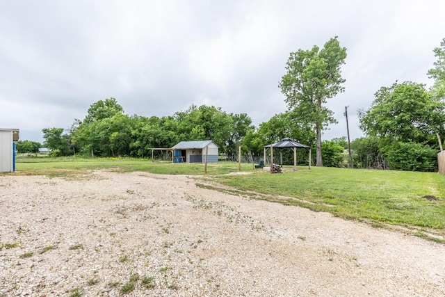 view of yard featuring an outdoor structure and a gazebo