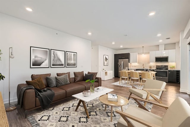 4361 S Congress Ave Unit 236, Austin, TX 78745 - living room featuring wood finished floors, recessed lighting, and baseboards