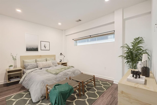 4361 S Congress Ave Unit 236, Austin, TX 78745 - bedroom featuring dark wood finished floors, baseboards, and recessed lighting