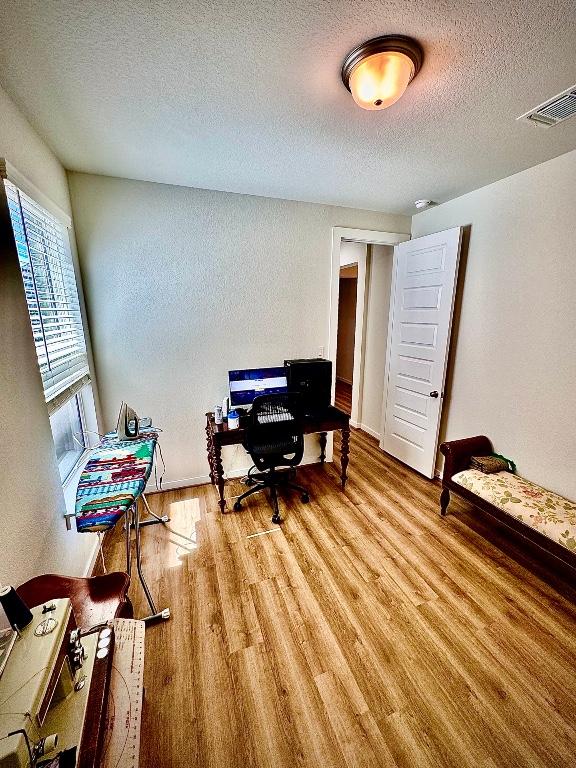 4319 Port Hope St, Round Rock, TX 78665 - office featuring wood finished floors and a textured ceiling