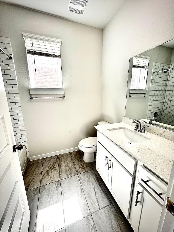 4319 Port Hope St, Round Rock, TX 78665 - bathroom featuring vanity, tiled shower, and marble finish floors