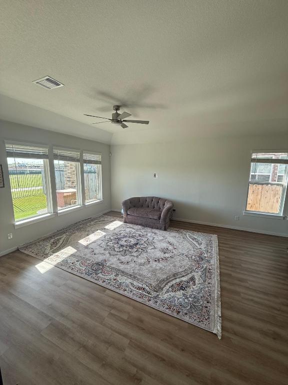 4319 Port Hope St, Round Rock, TX 78665 - living area with wood finished floors, ceiling fan, and a textured ceiling