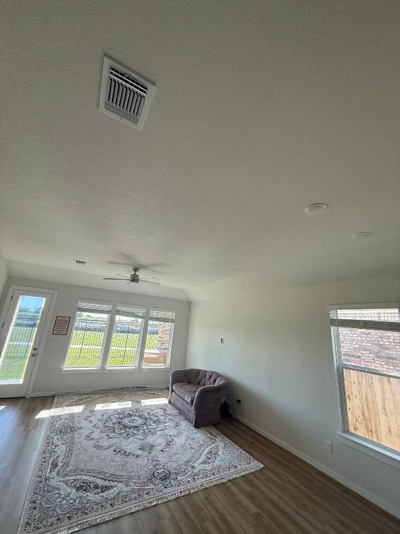 4319 Port Hope St, Round Rock, TX 78665 - sitting room with wood finished floors, a ceiling fan, and baseboards