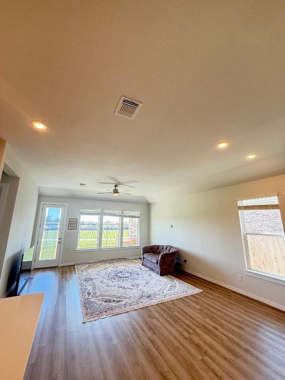 4319 Port Hope St, Round Rock, TX 78665 - living room featuring wood finished floors, ceiling fan, and recessed lighting