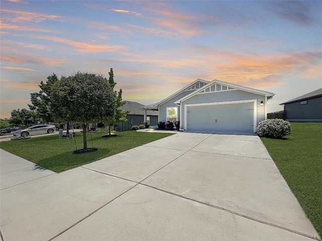127 Navidad River Dr, Hutto, TX 78634 - view of front of house featuring a front yard, concrete driveway, and a garage