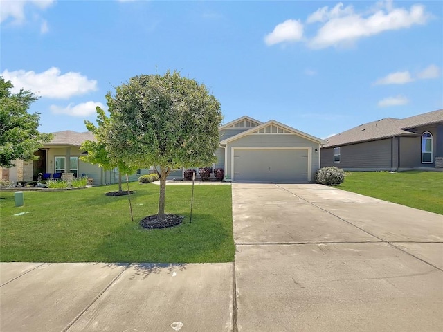 127 Navidad River Dr, Hutto, TX 78634 - view of front facade with a front lawn, driveway, and an attached garage