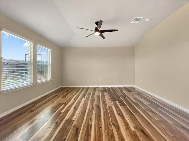 127 Navidad River Dr, Hutto, TX 78634 - empty room with wood finished floors, ceiling fan, baseboards, and lofted ceiling