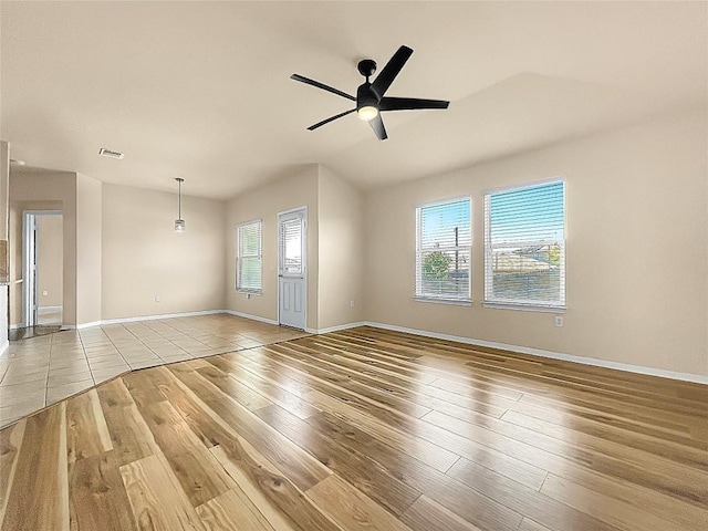 127 Navidad River Dr, Hutto, TX 78634 - spare room featuring hardwood / wood-style flooring, a ceiling fan, and baseboards