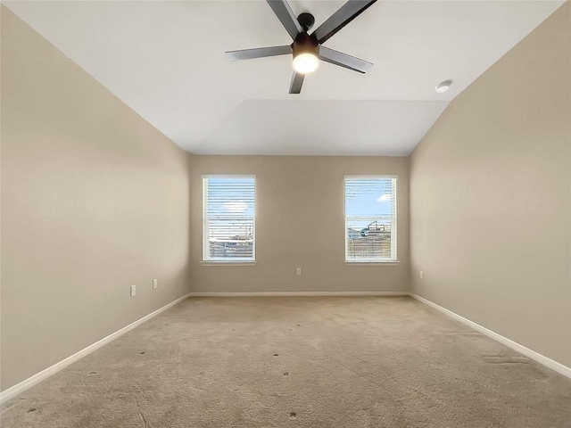 127 Navidad River Dr, Hutto, TX 78634 - spare room with a ceiling fan, light colored carpet, vaulted ceiling, and baseboards