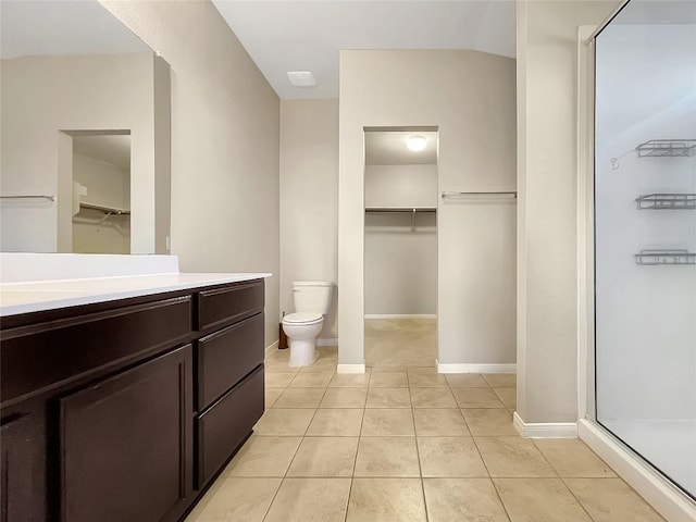 127 Navidad River Dr, Hutto, TX 78634 - full bathroom featuring a stall shower, toilet, vanity, tile patterned flooring, and a spacious closet