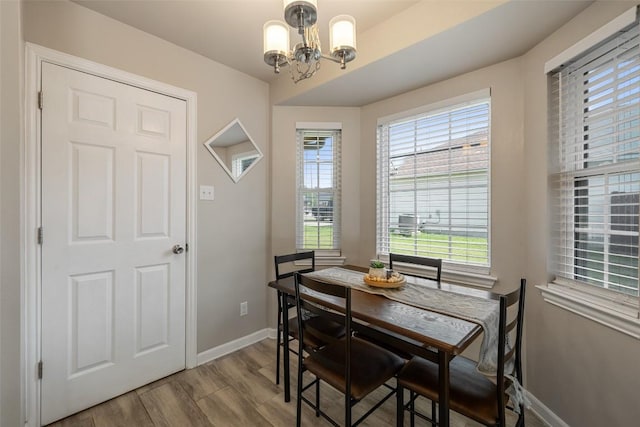 216 Lizzie St, Taylor, TX 76574 - dining area with a chandelier and wood finished floors
