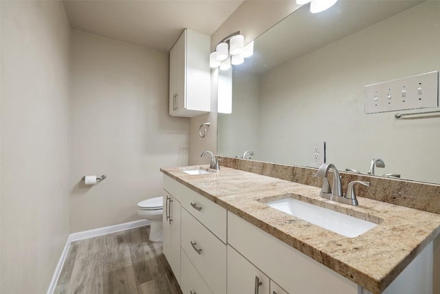 216 Lizzie St, Taylor, TX 76574 - bathroom with double vanity and wood finished floors