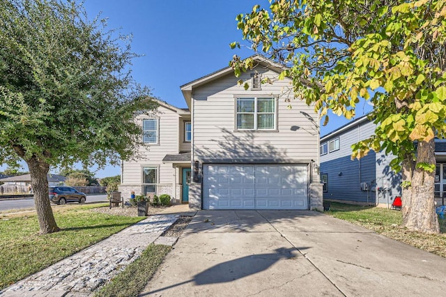 338 Liberty St, Hutto, TX 78634 - traditional-style home with driveway, a garage, and a front lawn
