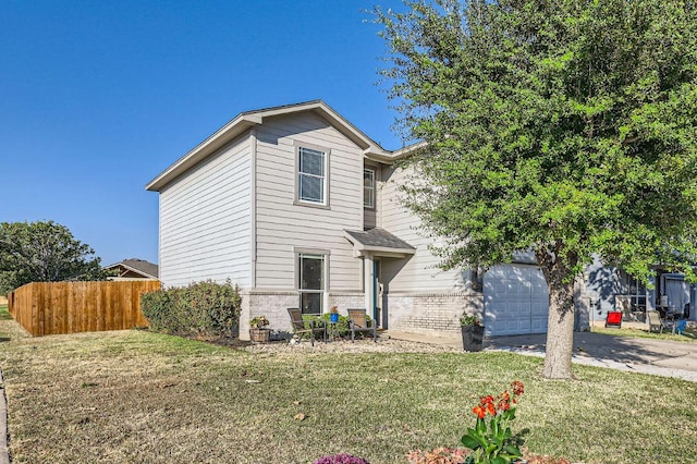 338 Liberty St, Hutto, TX 78634 - traditional-style house with fence, a front lawn, brick siding, and concrete driveway