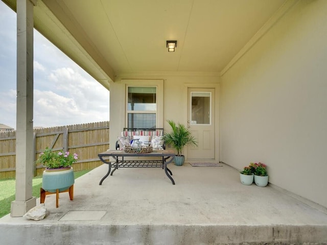 view of patio / terrace featuring fence