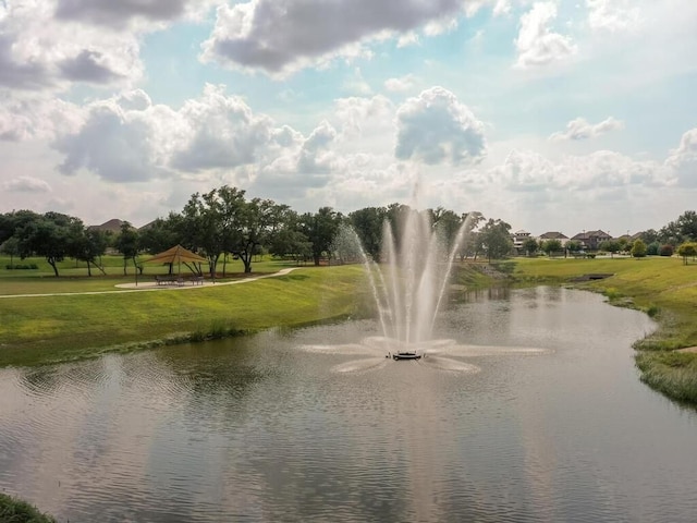 surrounding community with a water view, a gazebo, and a yard