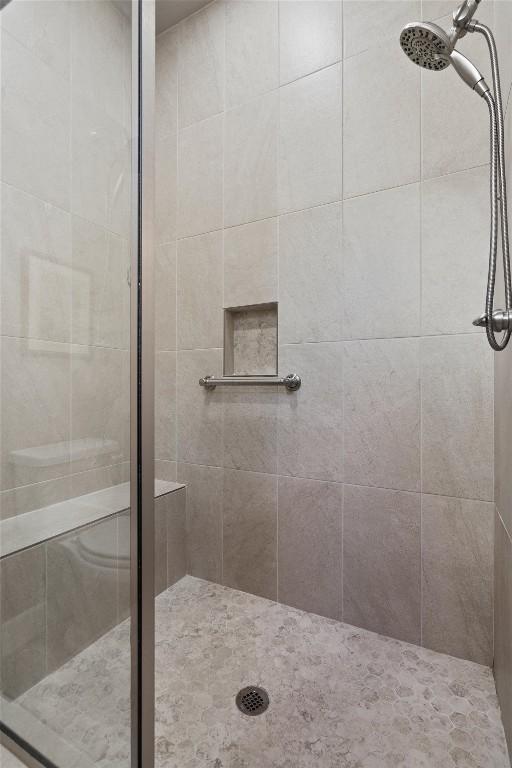 full bathroom featuring a stall shower