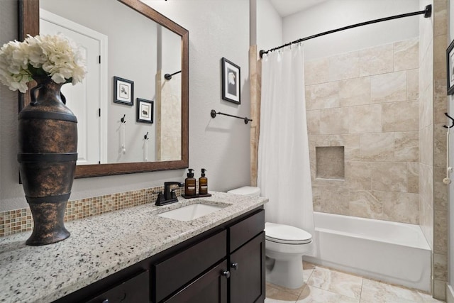bathroom featuring vanity, toilet, and shower / bath combination with curtain