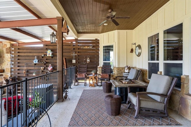view of patio featuring ceiling fan and a balcony