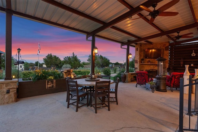 view of patio / terrace with a ceiling fan and outdoor dining space