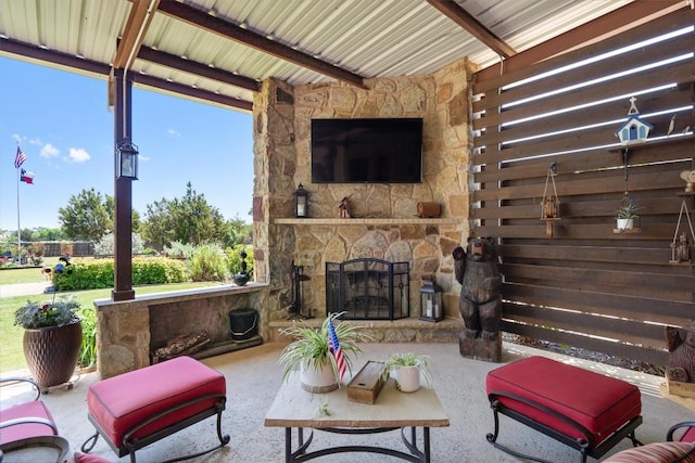 view of patio with an outdoor stone fireplace