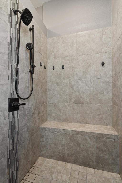 full bathroom with tiled shower