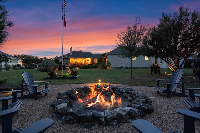 view of yard with a fire pit