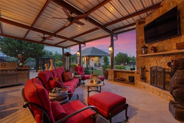 view of patio with an outdoor kitchen, ceiling fan, and an outdoor living space