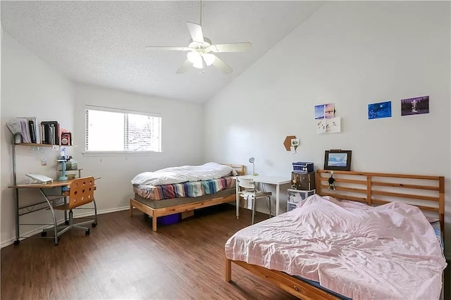 bedroom featuring wood finished floors, a textured ceiling, high vaulted ceiling, ceiling fan, and baseboards