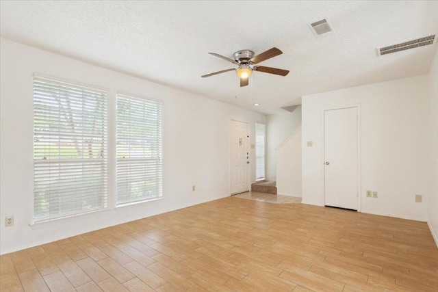 1015 E Yager Ln Unit 157, Austin, TX 78753 - unfurnished room featuring a ceiling fan, light wood-type flooring, and baseboards