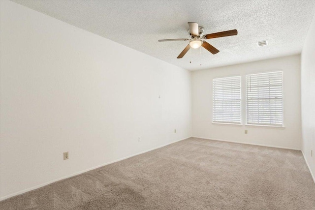 1015 E Yager Ln Unit 157, Austin, TX 78753 - spare room with light carpet, ceiling fan, a textured ceiling, and baseboards