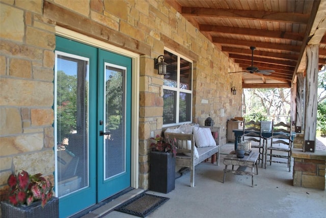 view of patio / terrace featuring a ceiling fan, french doors, and covered porch
