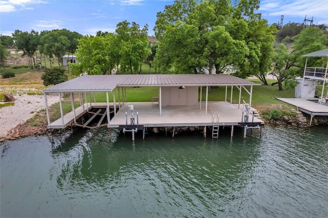 dock area with a water view and boat lift
