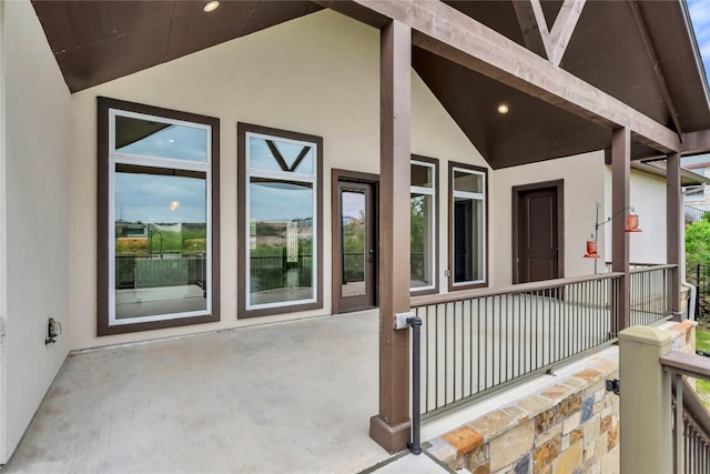 exterior space featuring a porch and stucco siding