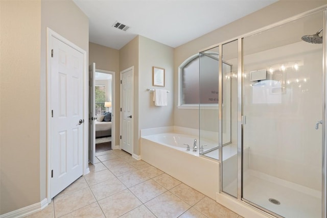 ensuite bathroom featuring a garden tub, a shower stall, visible vents, and tile patterned floors