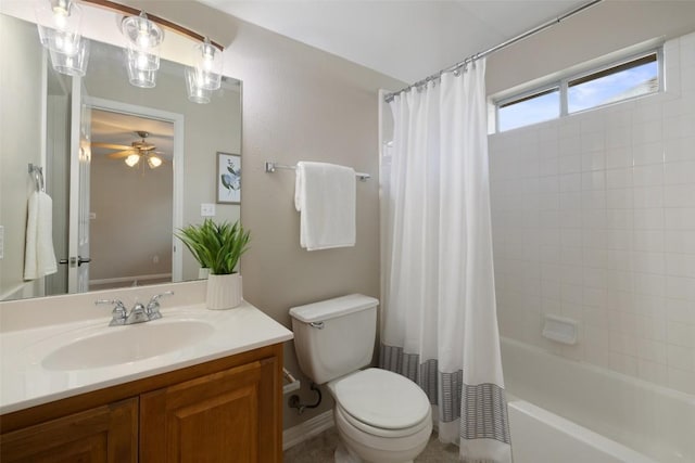 full bath with vanity, toilet, shower / bath combo, and a ceiling fan