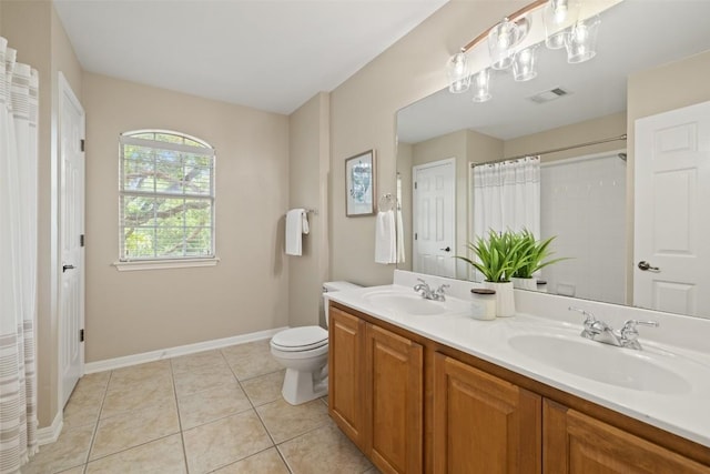 full bathroom featuring toilet, baseboards, visible vents, and a sink