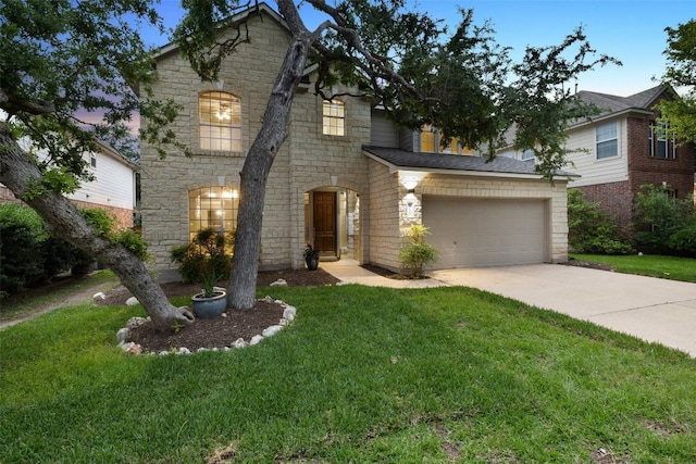 11121 Sandstone Trl, Austin, TX 78750 - view of front of home featuring stone siding, driveway, an attached garage, and a front yard